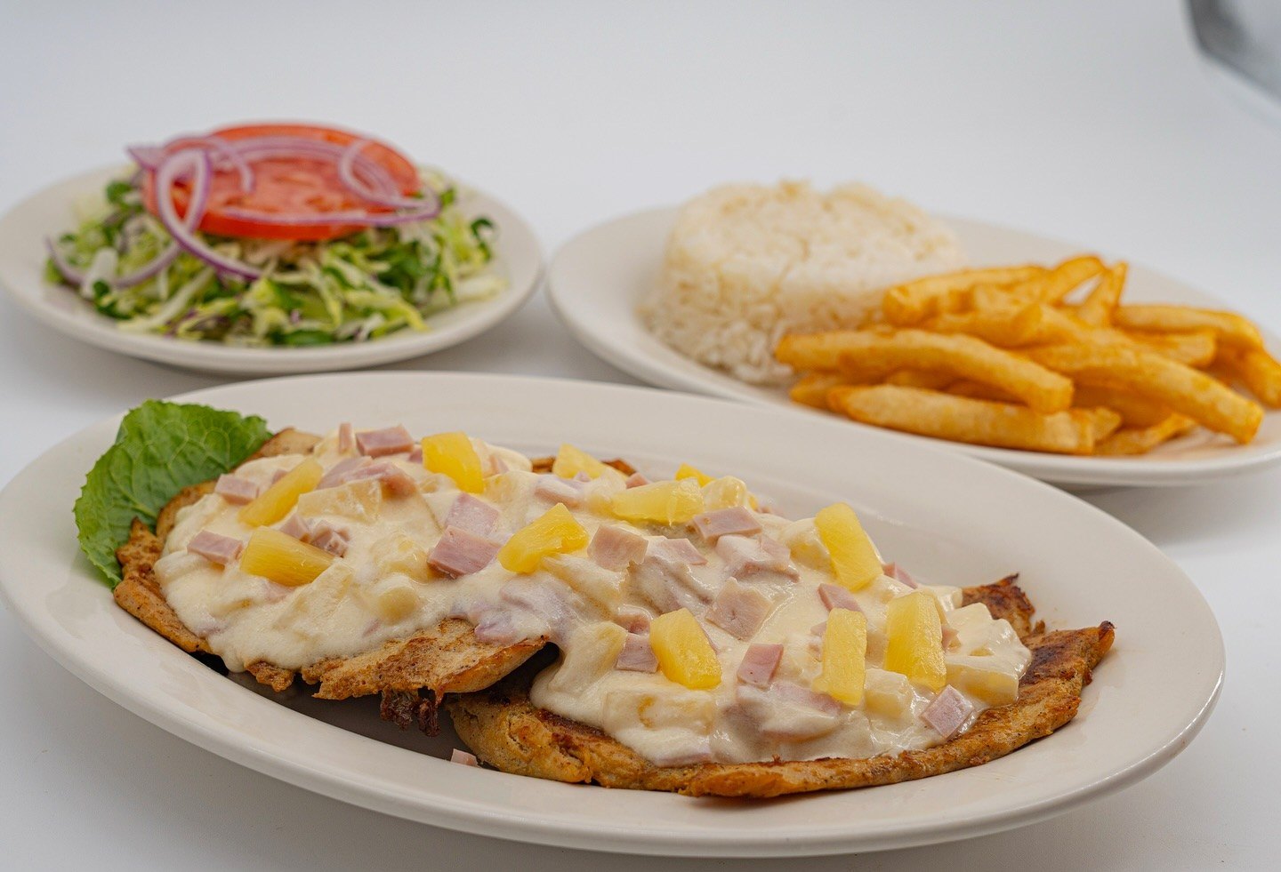 Grilled chicken breast plate with rice and fries